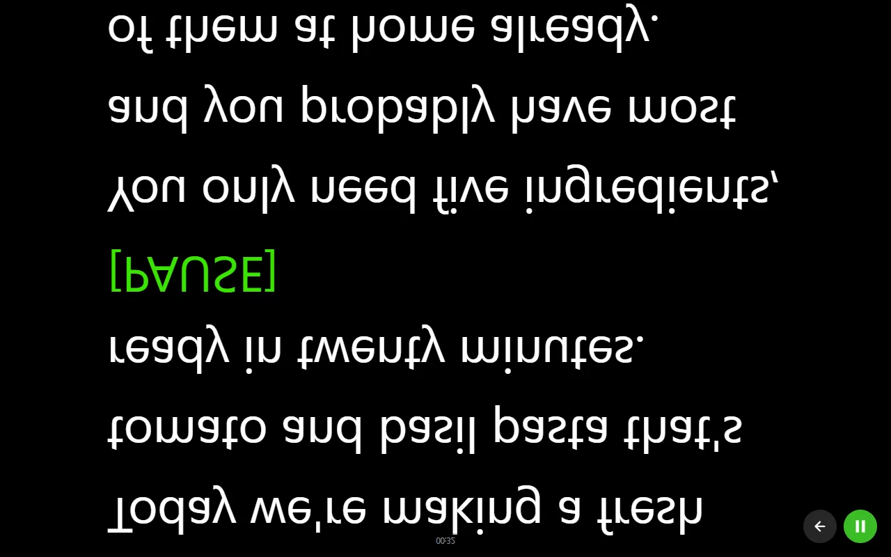Voice Assist reading screen with the script flipped upside down by the vertical mirror, white text on a black background